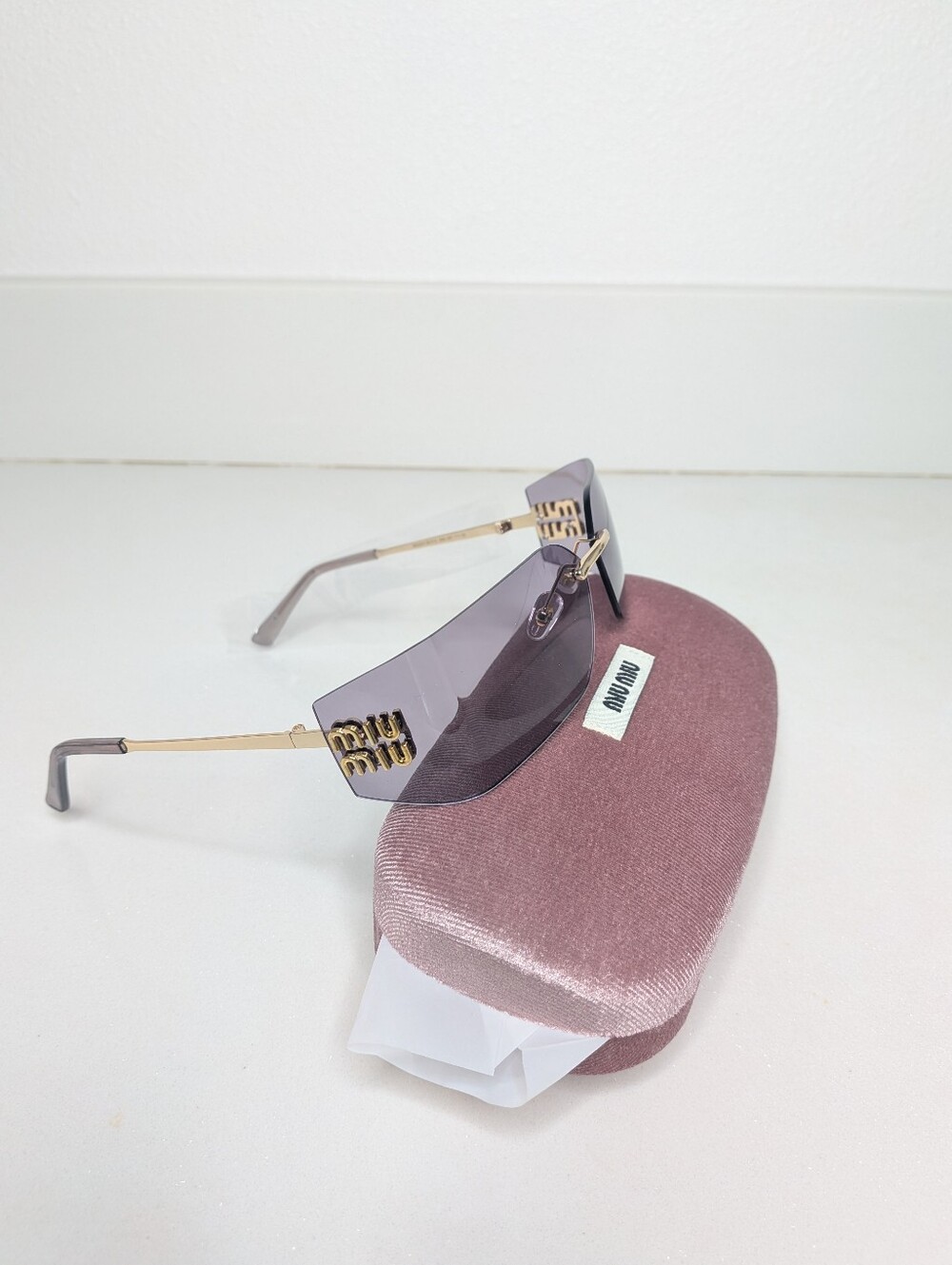 Miu Miu Purple Rimless Sunglasses